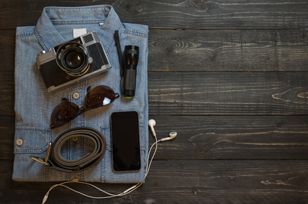 Planning for trip set of travel accessory on wooden background top view,in vintage tone style copy space.の写真素材