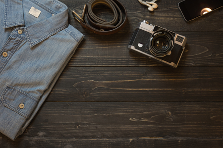 Planning for trip set of travel accessory on wooden background top view,in vintage tone style copy space.の写真素材