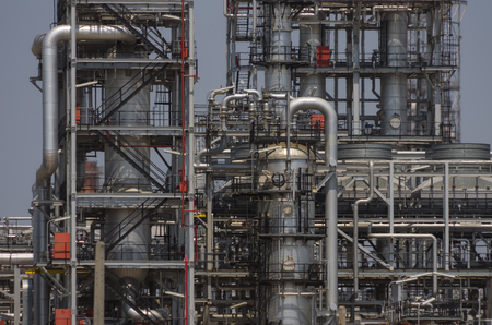 Pipes, chimneys of oil refinery. With the sky as a backdrop.の写真素材