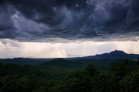 Aerial view, large rain storm over the landscape of Mae Moh mountain, Lampang, Thailand.の写真素材