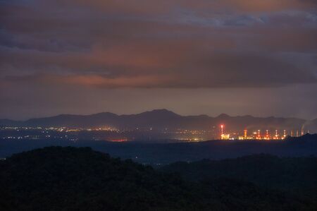 Soft focus, Aerial view of the Twilight coal-fired power plant with lightning and smoke caused by steam above the plant.の写真素材