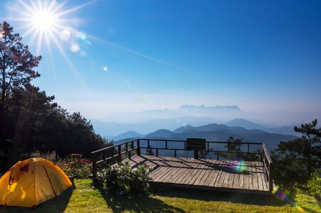 View of Doi Luang Chiang Dao, morning from sunrise with lens flare and camping tent form Doi Kham Fah Viewpoint, Padaeng National Park, Chiang Mai.の写真素材