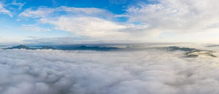 Nature beautiful, Aerial view Panoramic Fog and clouds over Mountains at sunrise in autumn Mae Moh, Lampang Thailand.の写真素材