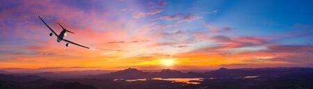 Commercial airplane flying above clouds in dramatic sunset light.  Fast Travel and transportation concept, Passenger airplane Travel.
の写真素材
