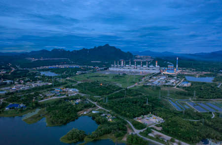 Aerial view of the Mae Moh coal-fired power plant with smoke and air released from the chimney Industrial factory Electric tower in environmental energy concept Lampang, Thailandの写真素材
