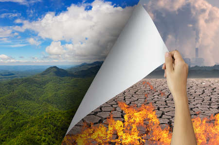 Change concept, Hand turning global warming page revealing Nature landscape, changing reality, hope inspiration to environmental protection and environmental campaign.の写真素材