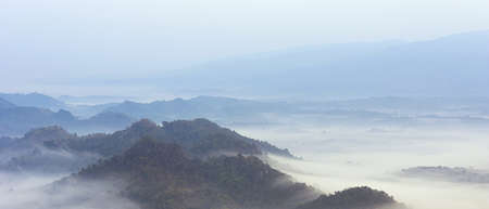 fog on mountain mae moh lampang in winter.の写真素材