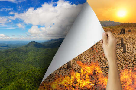 Change concept, Hand turning pollution wildfire page revealing Nature landscape, changing reality, hope inspiration to environmental protection and environmental campaign.の写真素材