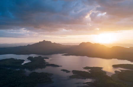 Beautiful Aerial view sunset over the mountain range at the north of thailand, Beauty rainforest landscape with fog in morning - Drone.の写真素材