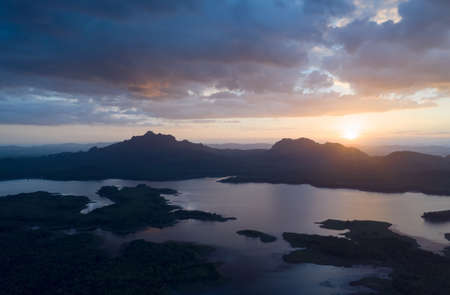 Beautiful Aerial view sunset over the mountain range at the north of thailand, Beauty rainforest landscape with fog in morning - Drone.の写真素材