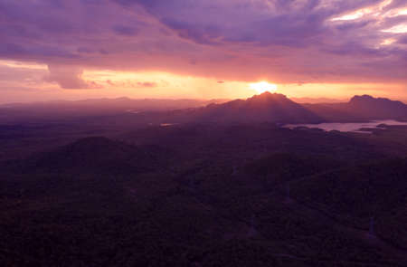Beautiful Aerial view sundown over the mountain range at the north of thailand, Beauty rainforest landscape with fog in morning - Drone.の写真素材