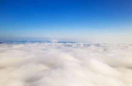 Aerial view Beautiful of morning scenery sea of cloud and the fog flows on high mountains.の写真素材