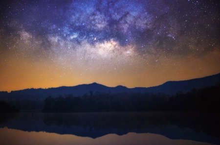 Panorama landscape Milky way galaxy with stars and space dust in the universe over mountain, long exposure.の写真素材