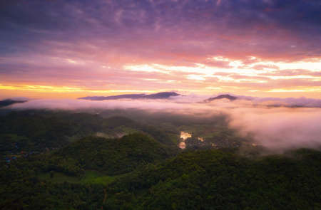 Aerial view Beautiful of morning scenery sea of cloud and the fog flows on high mountains.の写真素材