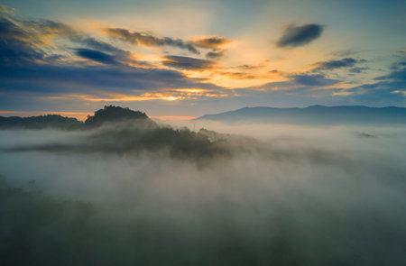 Aerial view Beautiful of morning scenery sea of cloud and the fog flows on high mountains.の写真素材