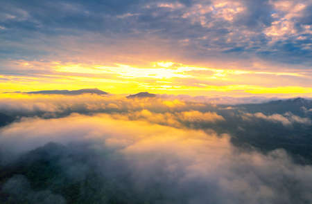 Aerial view Beautiful of morning scenery sea of cloud and the fog flows on high mountains.の写真素材