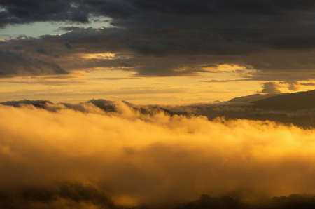 Aerial view Beautiful of morning scenery Golden light sunrise And the mist flows on high mountains, Wonder fog.の写真素材