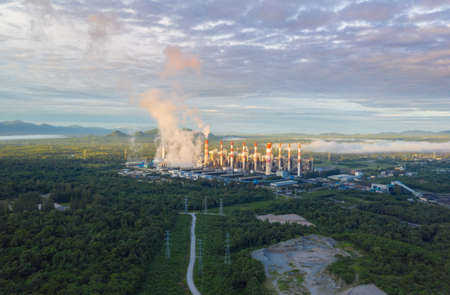 Aerial view coal power plant station and steam in the morning mist, Mae Moh, Lampang, Thailand.の写真素材