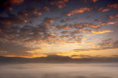 Aerial view Beautiful of morning scenery sea of cloud and the fog flows on high mountains.の写真素材