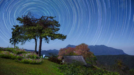 Beautiful Doi Luang Chiang Dao Mountains at night and star trails, Doi Mae Taman, San Pa Kia. Chiang Mai Province, Thailand.の写真素材