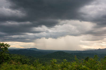 Nature environment Dark sky Big clouds Black moving storm clouds Thunderstorms on the horizon Time lapse Giant storms Fast moving Movie time Mea Mo, Lam pang Thailand.の写真素材