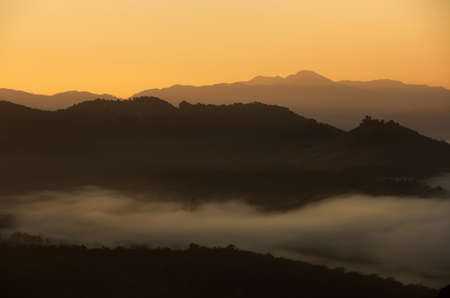 Aerial view Beautiful of morning scenery Golden light sunrise And the mist flows on high mountains, Baan Ja Bo, Mae Hong Son, Thailandの写真素材