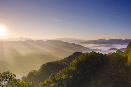 Beautiful aerial view landscape sunbeam with fog at morning, Baan jabo viewpoint. Mae Hong Son, Baan JABO one of the most amazing Mist in Thailand.の写真素材