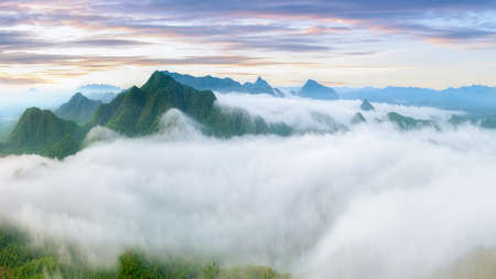 Beautiful aerial view sea of fog in the morning forest mountent with green mountains. Nong Ya Plong, Phetchaburi, Thailandの写真素材