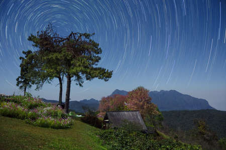 Beautiful Doi Luang Chiang Dao Mountains at night and star trails, Doi Mae Taman, San Pa Kia. Chiang Mai Province, Thailand.の写真素材