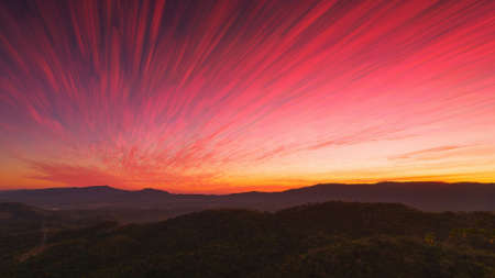 Beautiful Long exposure of morning sky cloudscape over fertile forest mountains. Pang Puai, Mae Moh, Lampang, Thailand.の写真素材