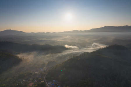 Fog in the morning forest with green mountains. Pang Puai, Mae Moh, Lampang, Thailand.の写真素材