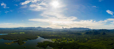 Aerial view Beautiful  panorama of morning scenery Golden light sunrise And the mist flows on high mountains forest and lake. Pang Puai, Mae Moh, Lampang, Thailand.の写真素材