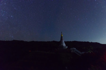 Star over a sacred temple at Doi Inthanon National Park, Chiang Mai, Thailand.の写真素材