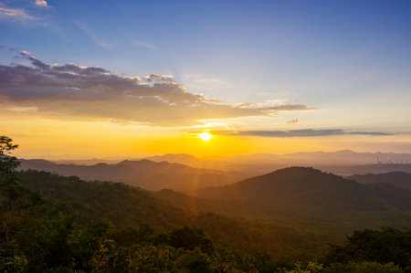 Beautiful  landscape sunset over peak Mountain with warm light Mae Moh  Lampang, Thailand.の写真素材