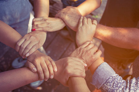 Team Work Concept : Group of Diverse Hands Together Cross Processing of young people in the nature