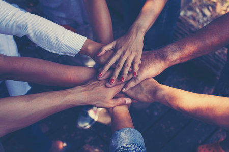 Team Work Concept : Group of Diverse Hands Together Cross Processing of young people in the natureの写真素材