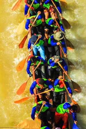 BURIRAM, THAILAND - NOV 7-8 : Unidentified crews ,waterman strong in traditional Thai long boats compete during King Cup Traditional Long Boat Race Championship on NOVEMBER, 2015 in BURIRAM ,Thailandのeditorial素材
