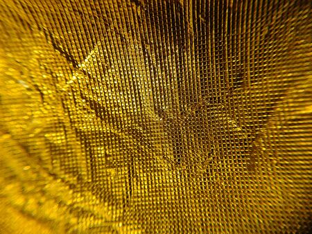 Close up Patterned Background golden , Macro photo , Selective focus , gold backgroundの写真素材