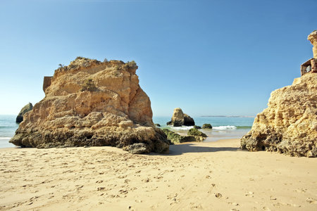 Huge rocks at the beach near Alvor in Portugalの写真素材
