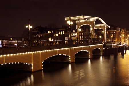 Thiny bridge by night in Amsterdam the Netherlands の写真素材