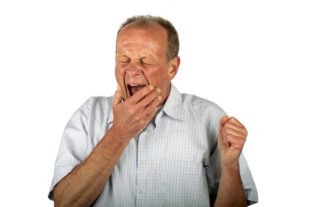 Yawning man on a white backgroundの写真素材