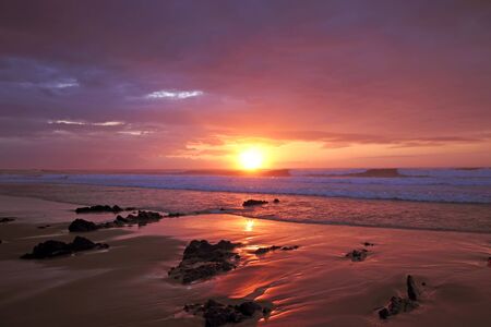 Sunset at Praia Vale Figuiras in Portugalの写真素材