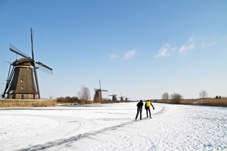 Ice skating at Kinderdijk in the winter in the Netherlandsの写真素材