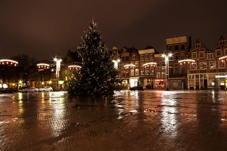 City scenic from Amsterdam at the Nieuwmarkt in the Netherlands by nightの写真素材