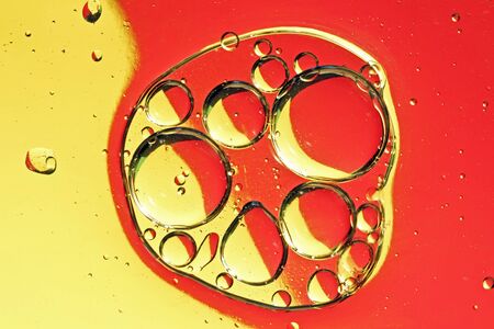 Oil drops on a water surfaceの写真素材