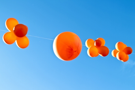 Orange balloons to celebrate queensday in the Netherlandsの写真素材