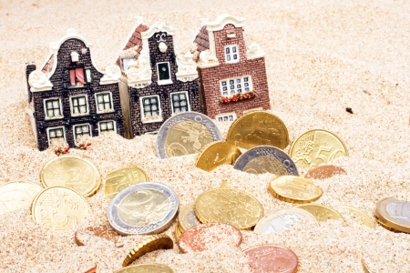 Houses and euro money in the sandの写真素材
