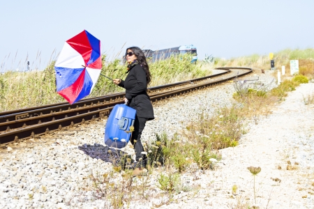 Young woman desperately running after the trainのeditorial素材