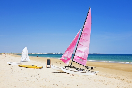 Sailboats at the beach in Portugalの写真素材