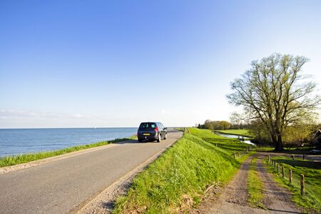 View in the countryside from the Netherlands at the IJsselmeerの写真素材